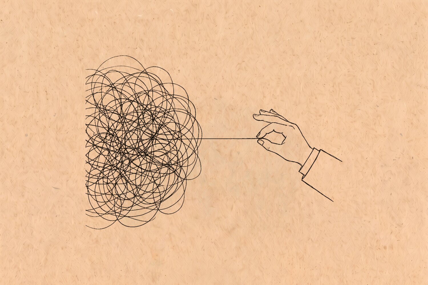 A hand pinching one single line and pulling it clear out of a dense tangled knot
